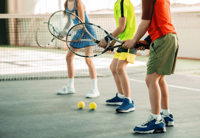 group of kids beginner tennis drills